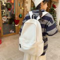 Simple Japanese solid color backpack, large capacity, versatile, portable student school bag, high school student men's and women's travel bag. 
