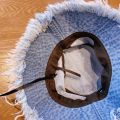 Fashionable Distressed Denim Fisherman Hat Women Washed Denim Bucket Cap with Tassel and Iron Label Outdoor Sun Protection Wide Brim.