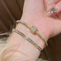 New gold titanium steel bracelet for women, high-end zircon couple bracelet, light luxury plain ring bracelet, hand jewelry. 
