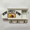 Home sweet home white color wooden key holder. 