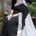 Checkered Elegance with the Black and White Cotton Dhupian Check Saree - A Stylish Choice for All Seasons and Casual Wear. 