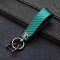 Automotive carbon fiber pattern fashion long metal key chain automotive leather key chain spring ring horseshoe buckle. 