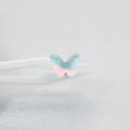 SMTNEK resin titanium steel outer teeth translucent rainbow color butterfly lip stud earrings stainless steel piercing jewelry.