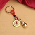Brass hollow gourd keychain, cinnabar bottle on the lid copper gourd five emperor money key pendant factory direct supply.