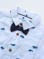 Baby Boy Dress Set: White Printed Full Sleeve Shirt and Navy Blue Pant with Dungarees.