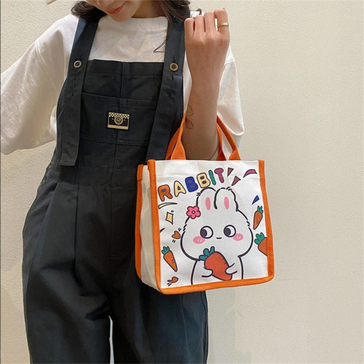 Canvas%20Bunny%20Canvas%20Bag%20Fashionable%20Lightweight%20Printed%20Design%20Cartoon%20Tote%20Bag%20%20handles%20Cute%20Lunch%20Bag%20for%20Casual%20Outings%20School%20Accessory%20Female%20Students%20Lunch%20Storage%20Gift%20option%20-%20Image%202