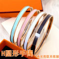 H Aijia Xiaohongshu recommends enamel round letters epoxy glue color plain circle titanium steel bracelet wholesale cross-border e-commerce. 