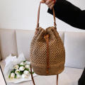 Eco-Friendly Bamboo Handle Straw Bag Chic Natural Lightweight Handmade Bamboo Woven Handbag Sustainable Handcrafted Handmade Straw Woven Beach Bag for Beach Vacations Summer Outings Casual Gatherings. 