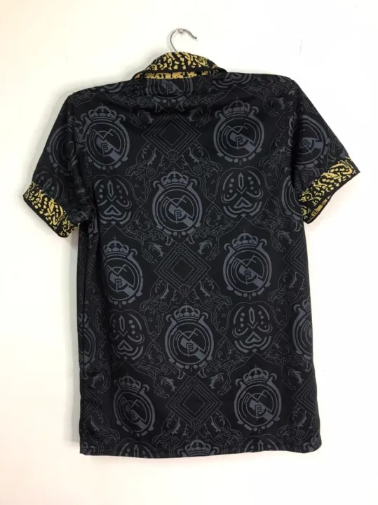 Real%20Madrid%20(With%20Embroidery)%20Premium%20Football%20Jersey%20Black%202023/24%20-%20Golden%20-%20Full%20Sleeve%20-%20Image%202