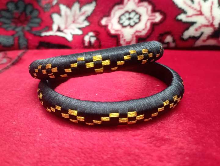 1%20pair%20back%20Sutar%20churi%20bangles/churi%20size%20for%20girls%20and%20women%20Shutar%20churi%20Silk%20Elegance:%20Handcrafted%20Silk%20Thread%20and%20Plastic%20Bangles%20-%20Image%202