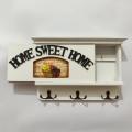 Home sweet home white color wooden key holder. 