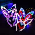 Yiwu luminous toys pass the new night market luminous stall windmill toys flash children's hairpin batch.