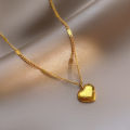 Light luxury love love titanium steel necklace women's versatile new clavicle chain plated 18K gold simple temperament peach heart necklace.