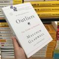 Outliers: The Story of Success by Malcolm Gladwell - Yellow - Paperback. 
