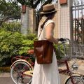 Paloma Wool first layer of oil wax cowhide vintage one-shoulder crossbody tassel bucket bag white Baihe same women's bag.