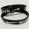 Nike Embossed Black Rubber Band. 