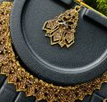 Dull gold color chocker necklace with one pair earring and one nalal theli with gold stone for girl and women. 