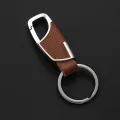 Luxury Leather + Zinc Alloy Men and Ladies Keychain Black Clasp Creative Keyring Holder Car Key Chain For Men Jewelry Gift. 