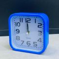 Square Simple Alarm Clock Battery Powered Time Clock Ornament for Home Bedroom Dormitory Party Background. 