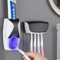 Automatic Toothpaste Dispenser Wall Mount Dust-proof Toothbrush Holder Wall Mount Storage Rack Bathroom Accessories Set Squeezer  Automatic Toothpaste Dispenser With Automatic Toothpaste Squeezing Device Toothbrush Holder Set Toothbrush Holder. 