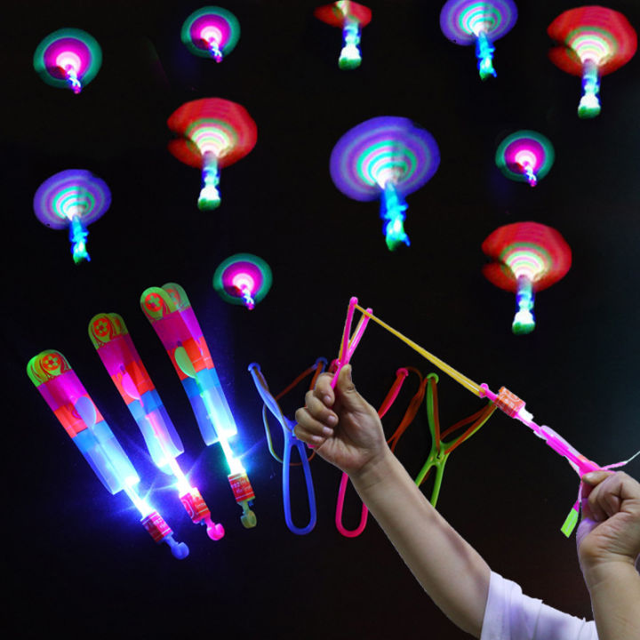 12 Frappeurs à fusées à flèches étonnantes. LED Light Helicopter Flying Toy - Elastic Powered