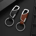 Luxury Leather + Zinc Alloy Men and Ladies Keychain Black Clasp Creative Keyring Holder Car Key Chain For Men Jewelry Gift. 