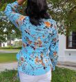 Tropical Elegance - Light Blue Floral Wrap Top. 