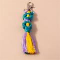 Handmade Daisy keychain Stylish Colorful Macrame key ring Bohemian purse charm for Backpack accessory Key organizer Bag decoration Gift for women Boho fashion statement. 