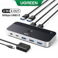 UGREEN USB 3.0 Switch 2 Computers Sharing USB C & A Devices, 4 Port USB Switcher Shareing Keyboard and Mouse, Printer/Scanner USB Switch Hub for Two Computers with 2 USB3.0 Cables and Remote. 