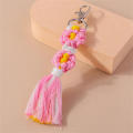Handmade Daisy keychain Stylish Colorful Macrame key ring Bohemian purse charm for Backpack accessory Key organizer Bag decoration Gift for women Boho fashion statement. 