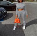 European and American women's sportswear two-piece casual sports set with exposed navel top and pants hooded shirt street set. 