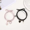 Cartoon Magnetic Couple Bracelets with Cat Love Heart Pendant - black and pink - 2 pieces. 