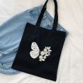 Natural fabric stylish black tote bag with hand paintings for everyday travel, dream catcher design. 