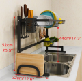 Double sink stainless steel dish drying rack over sink with cutlery holder. 