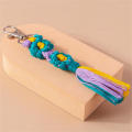 Handmade Daisy keychain Stylish Colorful Macrame key ring Bohemian purse charm for Backpack accessory Key organizer Bag decoration Gift for women Boho fashion statement. 