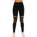 Women's tight black ripped leggings. 