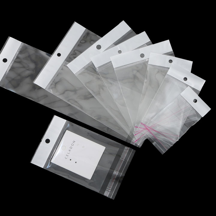 100PcsTransparent%20Self%20Adhesive%20Seal%20Plastic%20Storage%20Bag%20OPP%20Pack%20Bag%20With%20Hang%20Hole%20Retail%20Packaging%20Pouch%20-%20Image%205