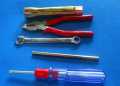tool kit ( plier , screwdriver , nut wrench, spark plug remover). 