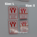 Handle With Care 500 / 200 / 100 English Sinhala Tamil Red Color Fragile Sticker for Daraz Packaging. 