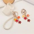 【HOT】 Elegant Maple Leaf Wristlet Keychain Cute Pearl Pendant With Keyrings For Women Keys Phones Creative DIY Wallets Decoration. 