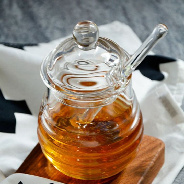Transparent%20glass%20honey%20jar%20with%20lid%20Honey%20Jar%20with%20Dipper,%20Clear,%209%20Ounces%20-%20Image%206