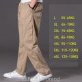 spring summer casual pants male big size 6XL Multi Pocket Jeans oversize Pants overalls elastic waist pants plus size men. 