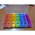 Four compartments daily pill organizer/storage multi colour. 