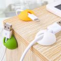 Data cable sorting device Desktop mobile phone data cable storage fixing seat clip Winding car Self-adhesive buckle mouse cable clamp Network sorting cable fixing device. 