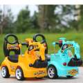 Kids ride on backhoe. 