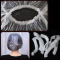 100Pcs/Bag Disposable Shower Bath Cap Plastic Waterproof Woman Head Hair Cover Bathing Hat. 