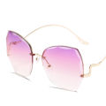 113 New personality diamond-cut rimless rimless sunglasses ladies retro irregular trend wear metal sunglasses uv400. 