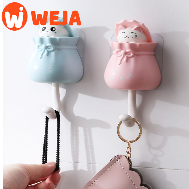 Creative cute retractable cat hook viscose strong load-bearing punch-free sucker hook on the porch wall at the door.