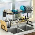 Double sink stainless steel dish drying rack over sink with cutlery holder. 