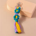 Handmade Daisy keychain Stylish Colorful Macrame key ring Bohemian purse charm for Backpack accessory Key organizer Bag decoration Gift for women Boho fashion statement. 